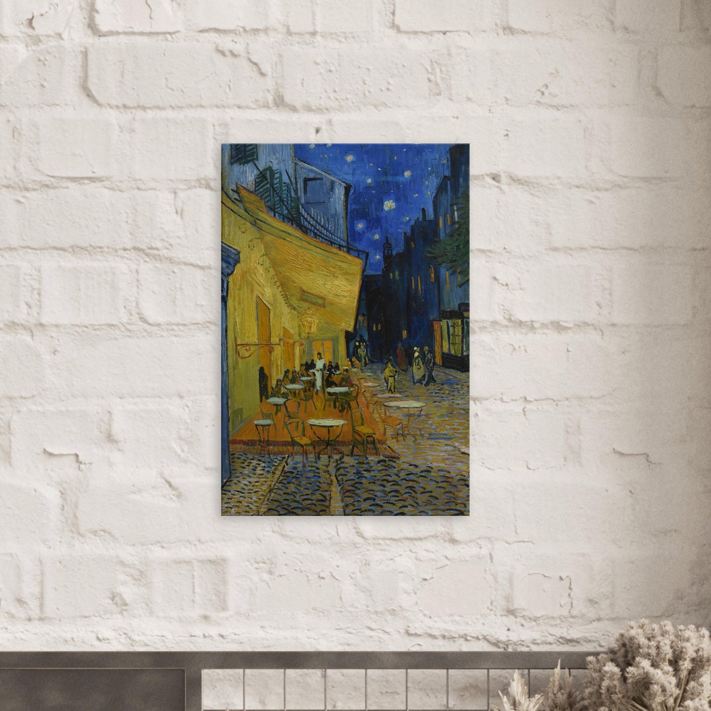 Canvas art reproduction of Van Gogh’s Café Terrace at Night, depicting a lively café scene under a glowing starry sky with vibrant blues, yellows, and whites.