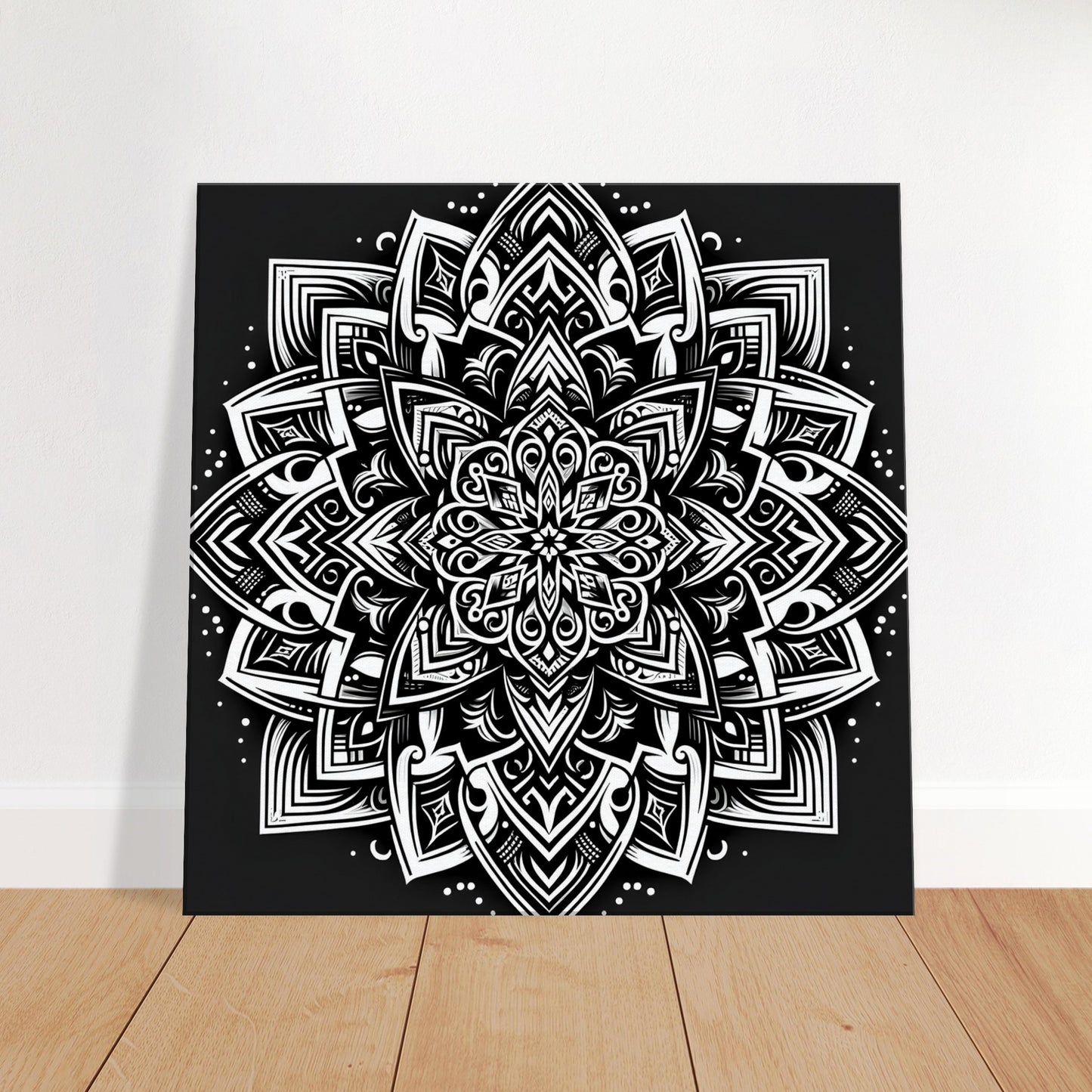 Mandala artwork featuring bold geometric patterns and fine filigree detailing in black and white for a dramatic, modern aesthetic.