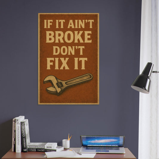 Vintage metal poster with bold distressed text “If It Ain’t Broke, Don’t Fix It” and wrench illustration.