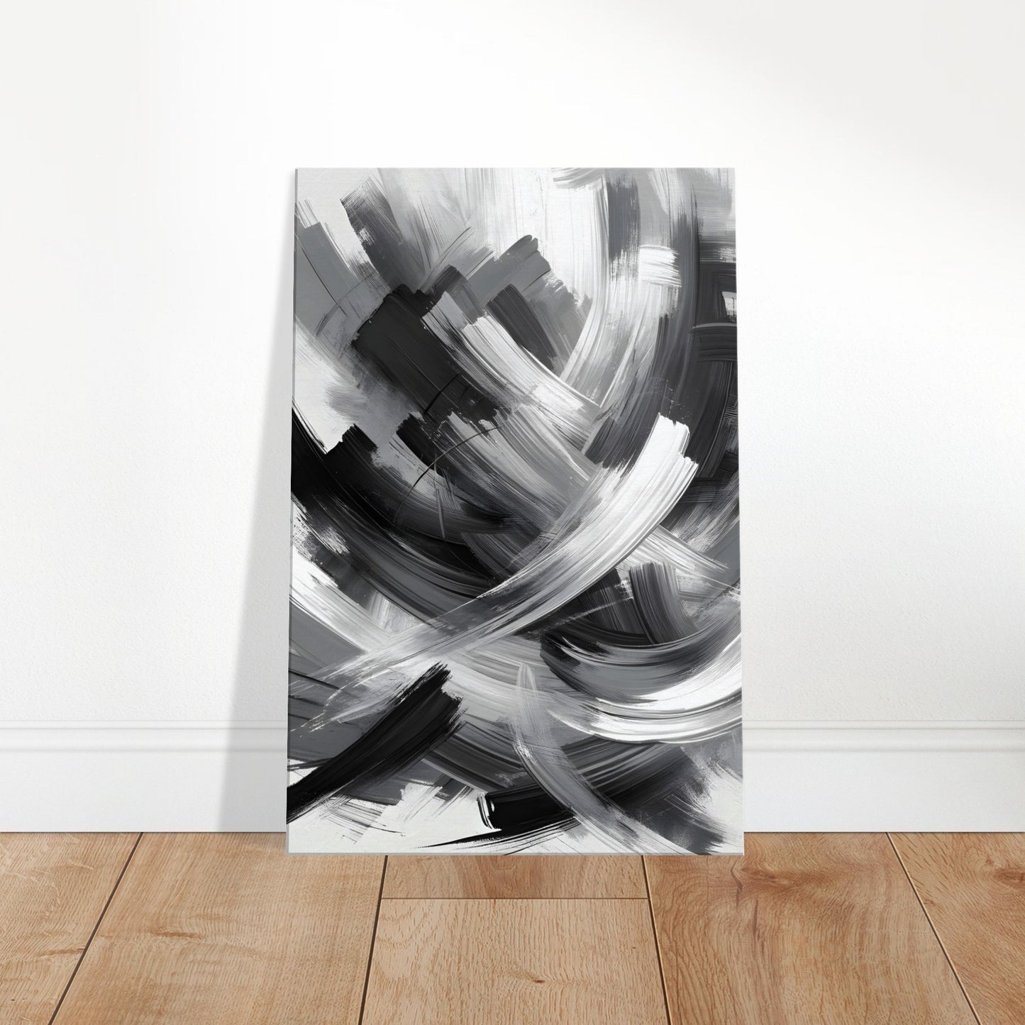 Abstract grayscale canvas featuring bold, energetic brushstrokes in varying shades of gray.