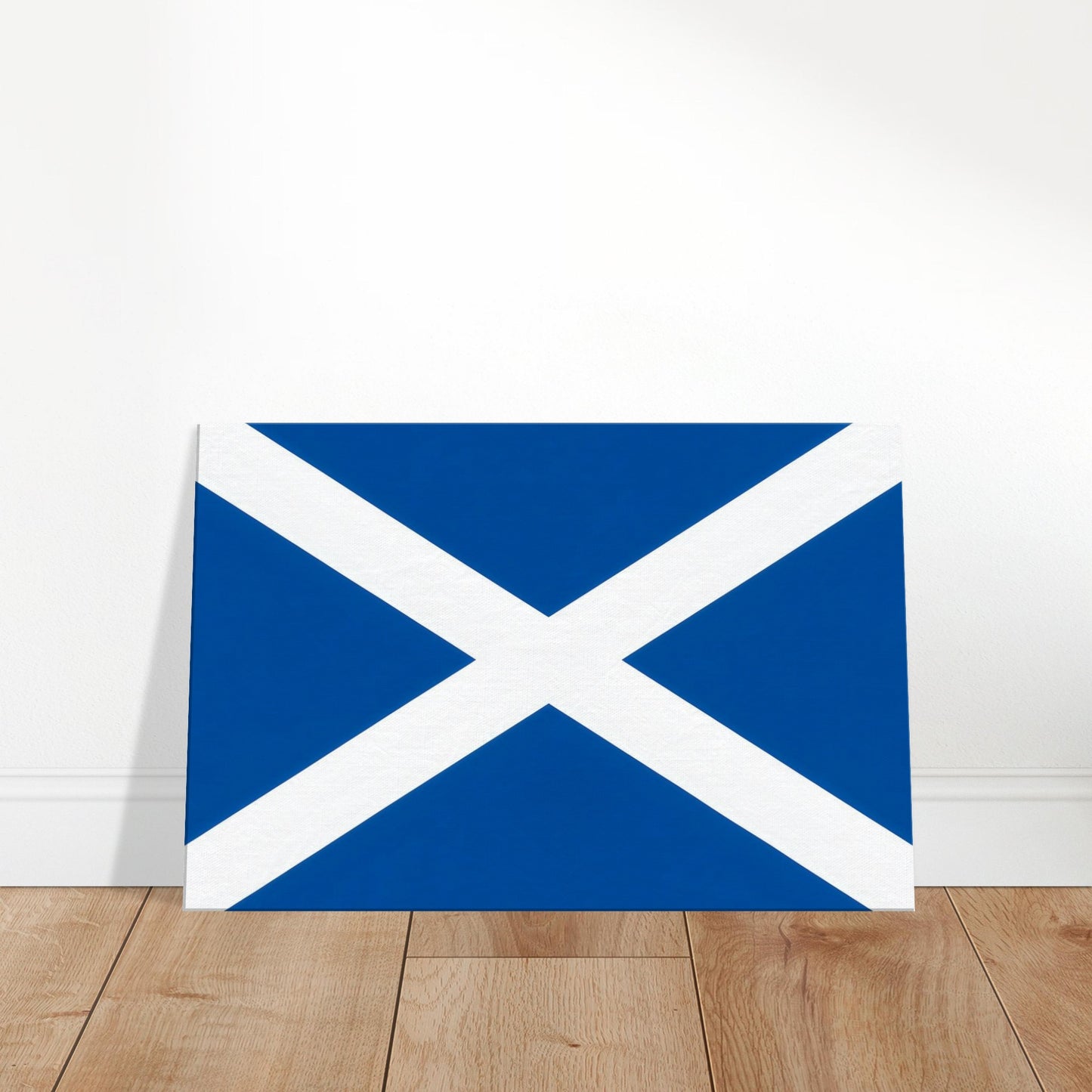 Premium canvas print of the Scotland flag showing the white Saint Andrew’s Cross on a deep cobalt blue background, landscape format.
