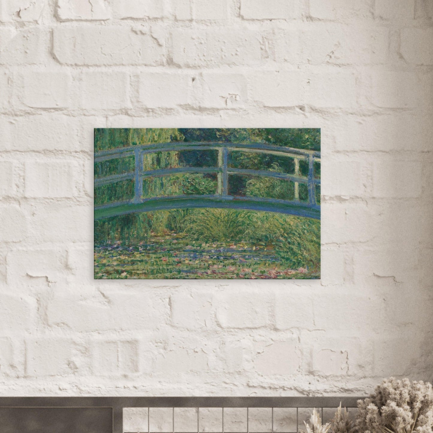 Canvas art reproduction of Claude Monet’s Water Lily Pond, featuring a Japanese bridge surrounded by blooming lilies with soft light and vibrant Impressionist brushwork.