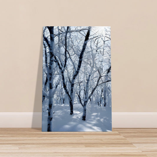 Canvas artwork of a snowy forest with tall trees, soft lighting, and a peaceful winter atmosphere
