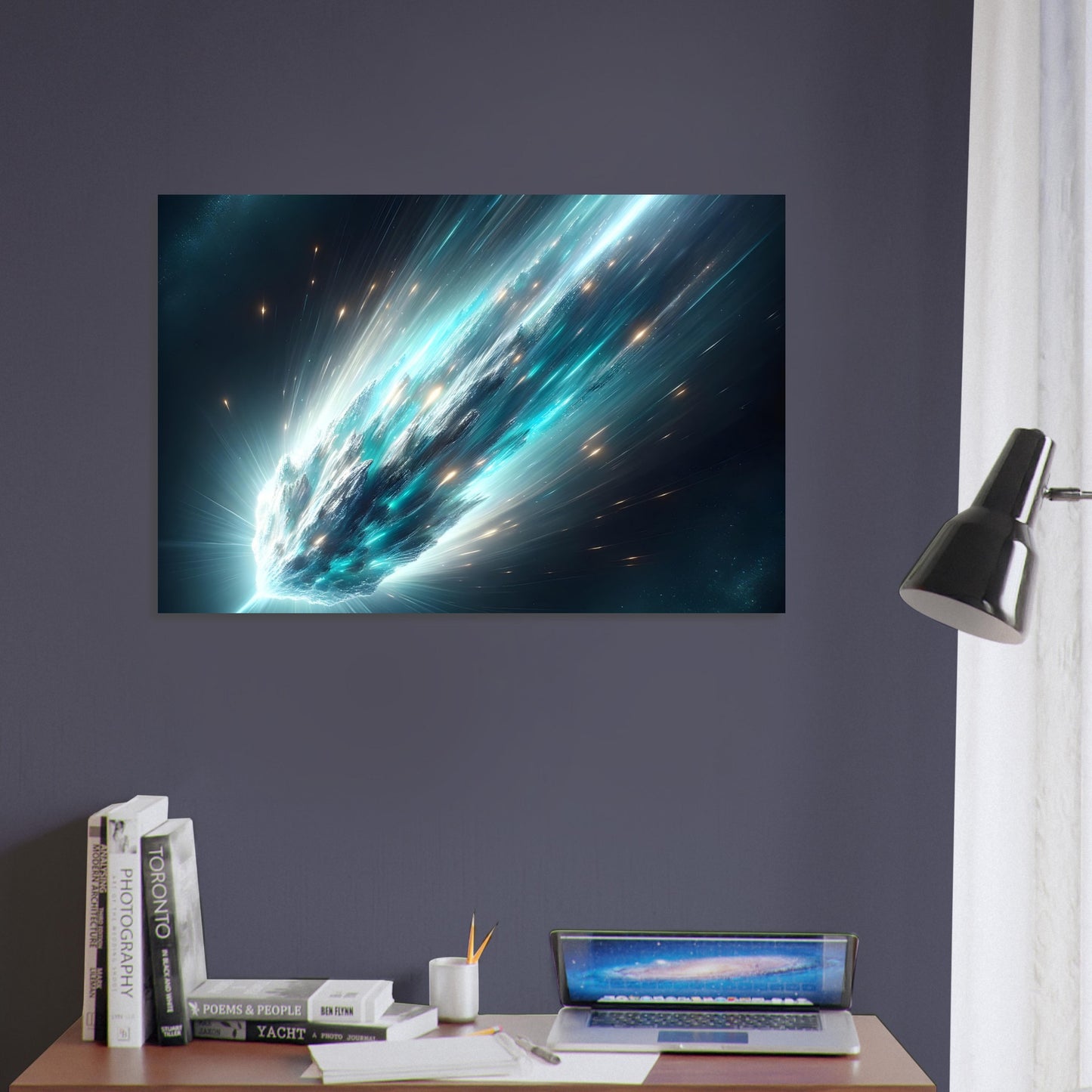 A metal poster featuring an image of a comet with a turquoise and silver color scheme displayed on a wall above a desk with a lamp and a laptop.