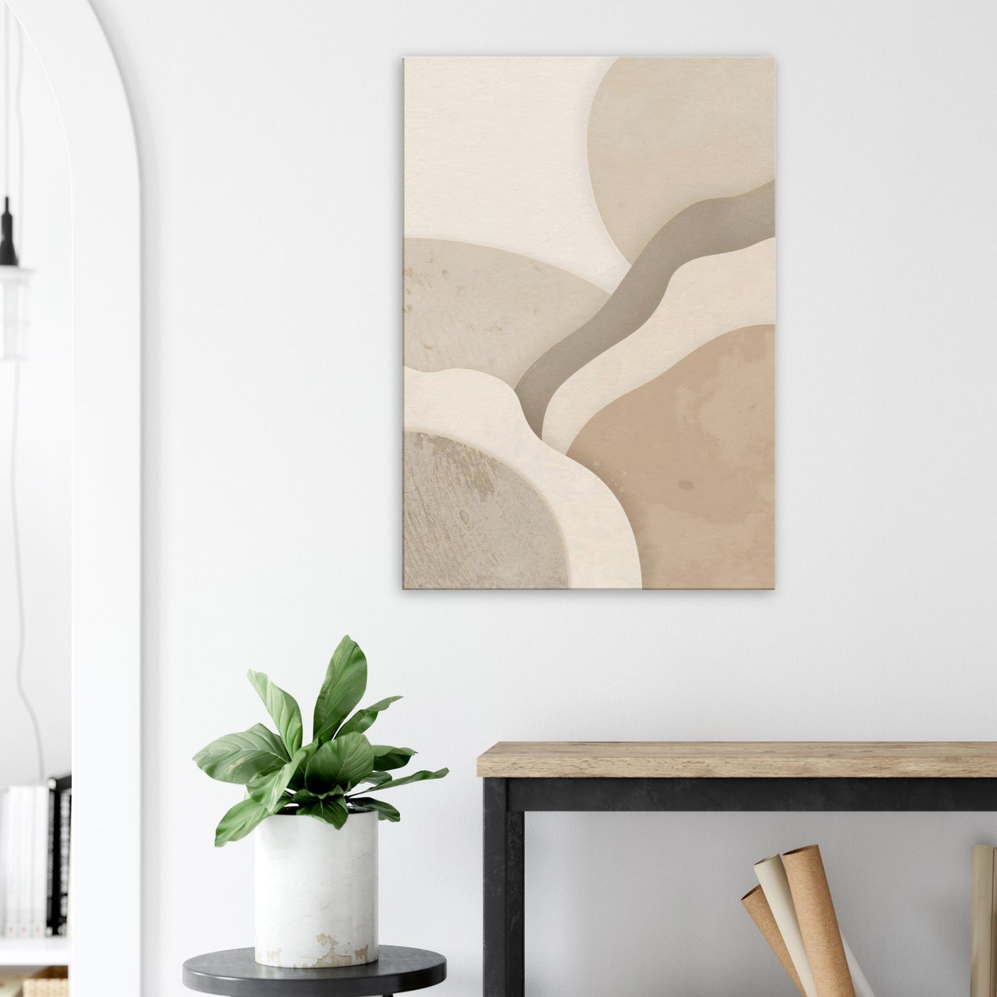 Cream, Abstract art piece on a wall above a desk with a plant and books.