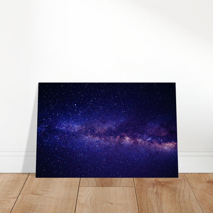 Colorful view of the Milky Way with dense stars and nebulae stretching across a deep space background.
