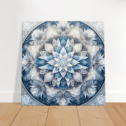 Mandala artwork featuring icy blue, silver, and frosty white on a cool gray background, capturing the serene essence of winter.
